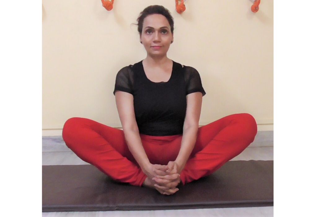 Yoga business coach performing badhha konasana in shwet yoga classes in thane
